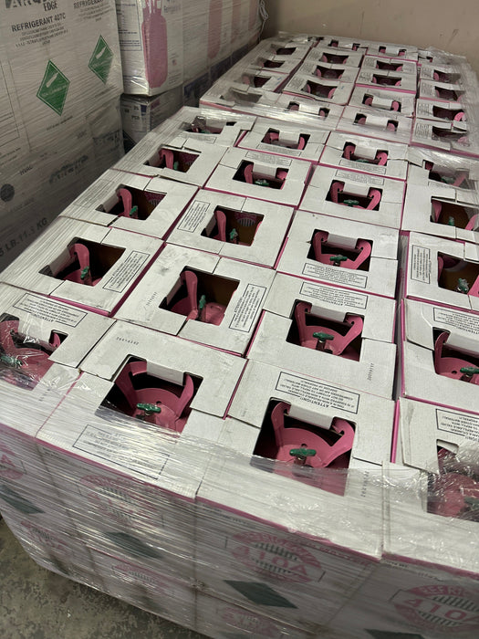 Top view of pink R-410A refrigerant cylinders packed on a pallet for distribution