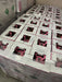 Top view of pink R-410A refrigerant cylinders packed on a pallet for distribution